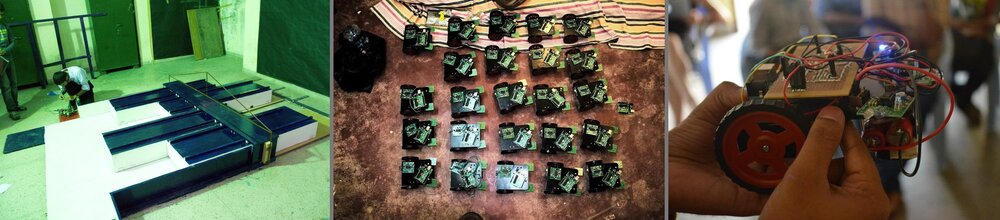 Getting the line-follower ready at IIT Kanpur — dozens of identical bots prepped, one held up for a last check before the run